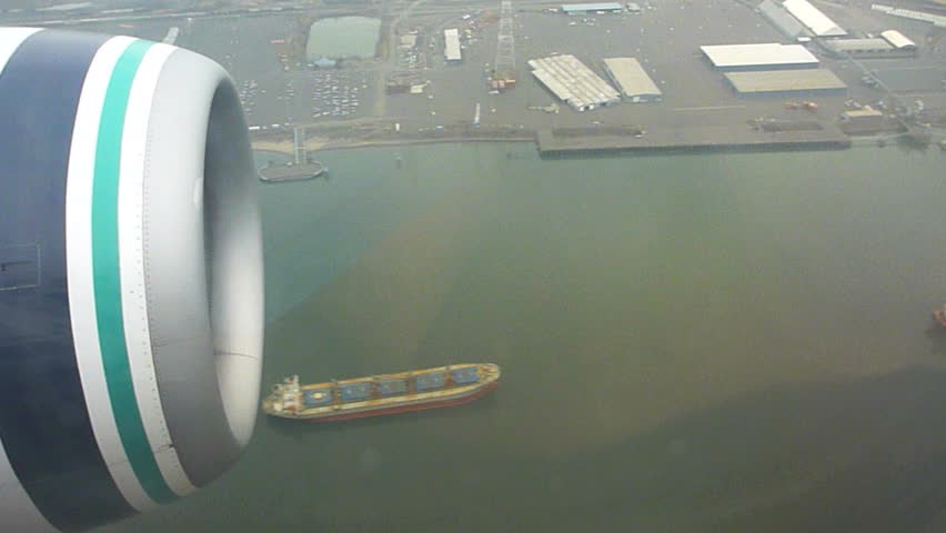 Flying in airplane over Portland, Oregon and the Columbia River with large
