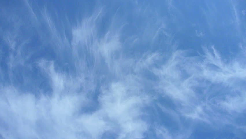 Airplane flying overhead on partly cloudy day in Portland, Oregon.