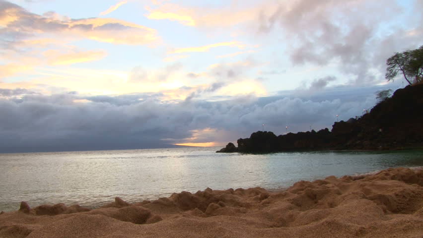 Sunset over the Pacific Ocean off the shores of Maui, Hawaii, time lapse