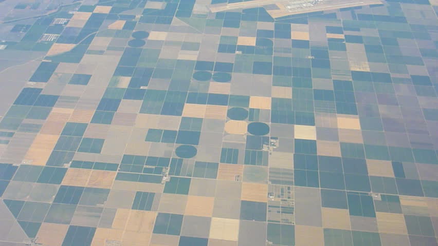 Flying in airplane over agricultural land in United Sates.