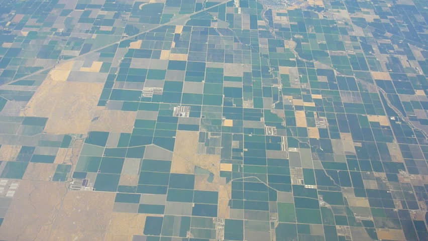 Flying in airplane over agricultural land in United Sates.
