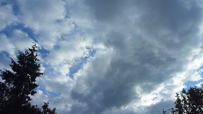 Airplane flying overhead on cloudy day in Portland, Oregon time lapse.