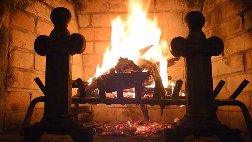 Fire burns in wood burning fireplace time lapse.