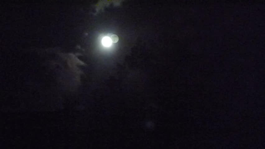 Simple Moon time lapse with dark night sky, forest evergreen trees, minimal