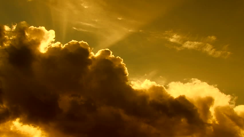 Beautiful cloudscape with large, building clouds and sunset behind shining sun rays and eventually breaking through cloud mass. Full HD 1920 x 1080. Royalty-Free Stock Footage #2304413