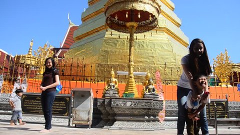 PHRAE, THAILAND - DECEMBER 29 : Asian thai people respect pray and travel and posing take photo at gold chedi of Wat Phra That Cho Hae temple on December 29, 2016 in Phrae, Thailand