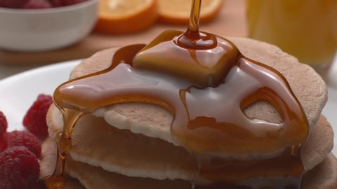 Syrup pouring onto stack of pancakes in super slow motion, shot on Phantom Flex 4K