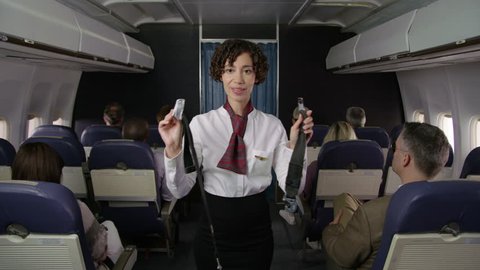 Airliner flight attendant explaining saftey rules