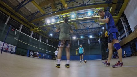 MOSCOW - SEP 13, 2016: MIREA industrial building with people train on volleyball playground. Timelapse