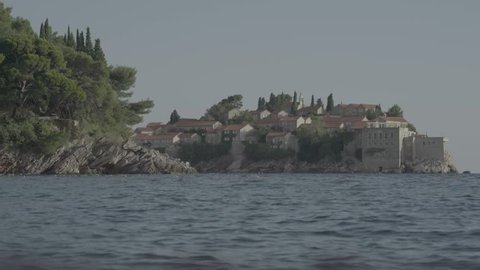 The island houses by the sea. Coastal seascape. Sveti Stefan. Montenegro. The Balkans
