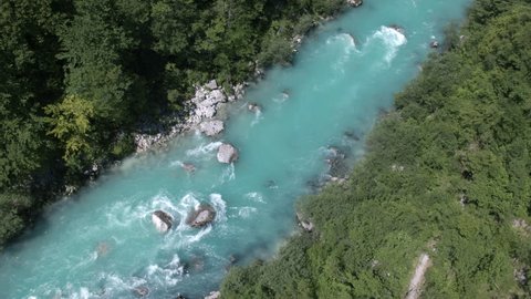Aerial - High angle view of flying over wide Soca river stream