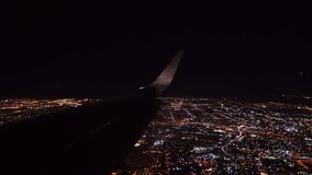 Aerial view from airplane window over Los Angeles City Lights on approach to landing at airport - Powered by Shutterstock - Get 15% off with code: PIKWIZARD15