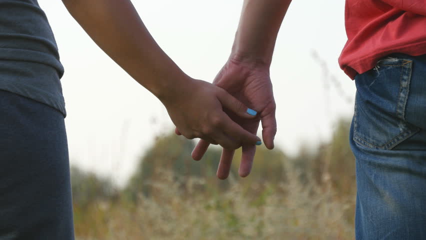 Young Couple Joining Hands Outdoor. című (100% jogdíjmentes) stockvideó  23070469 | Shutterstock