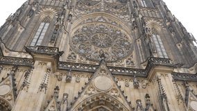 Metropolitan Cathedral of Saints Vitus Wenceslaus and Adalbert facade slow tilt 4K 2160p 30fps UltraHD footage - Gothic style church in Prague Czechia Czech Republic 3840X2160 UHD tiling video