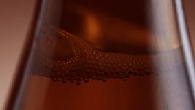 air bubbles in brown beer bottle in slow motion, 180fps slow motion