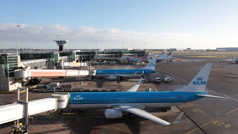 AMSTERDAM, NETHERLANDS - JANUARY 5, 2017: Time lapse of arrival the aircraft of Icelandair to the jetway dock of Schiphol airport. It is the fifth busiest airport in Europe in terms of passengers