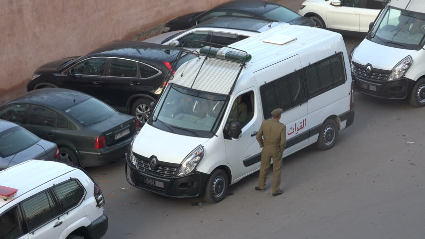 MARRAKESH, MOROCCO - DECEMBER 2016: Police van with officers waiting on the streets of Marrakech in Morocco
 | Shutterstock HD Video #23092855