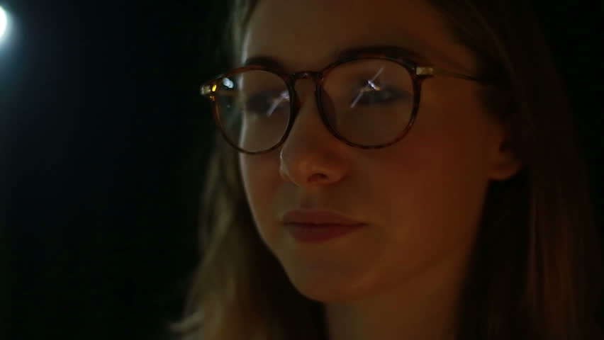 Girl looks at a visual installation. A new kind of art, generative graphics