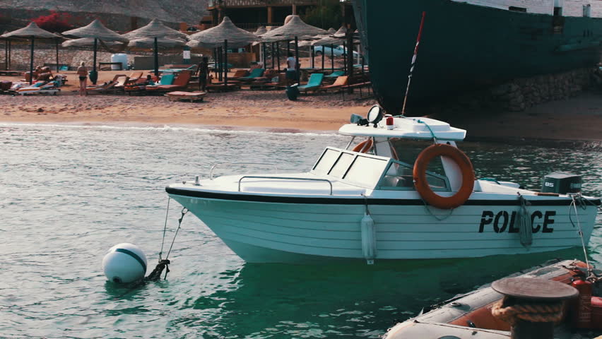 Boat water police moored near the shore in Red Sea