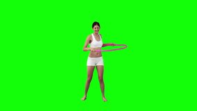 A woman is exercising with a hula hoop in front of a green background - Powered by Shutterstock - Get 15% off with code: PIKWIZARD15