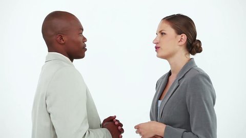 Business people talking to each other against a white background