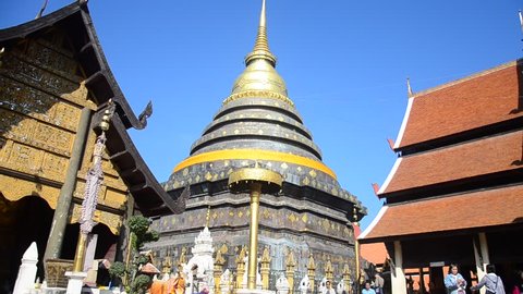LAMPANG, THAILAND - DECEMBER 27 :Asian thai people and foriegner people respect praying and walk visit chedi at Wat Phra That Lampang Luang Buddhist Temple on December 27, 2016 in Lampang, Thailand