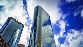Buildings with clouds in Houston time lapse 4K 1080p. Skyscrapers with clouds in background and blue skies time-lapse clip texas