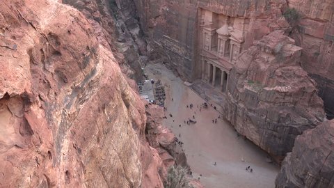 PETRA, JORDAN - NOVEMBER 2016: High angle view of the Treasury, a sandstone building carved in the cliffside in the ancient city of Petra in Jordan