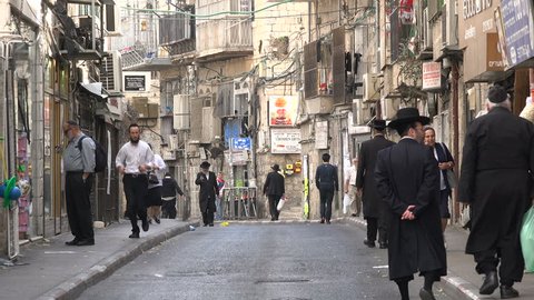JERUSALEM, ISRAEL - OCTOBER 2016: People walk through the ultra Orthodox neighborhood of Mea Shearim in Jerusalem, Israel