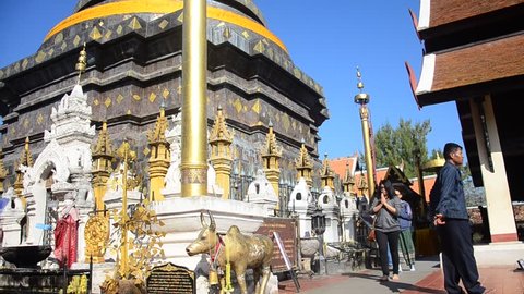 LAMPANG, THAILAND - DECEMBER 27 : Asian thai people and foriegner people respect praying and walk visit chedi at Wat Phra That Lampang Luang Buddhist Temple on December 27, 2016 in Lampang, Thailand