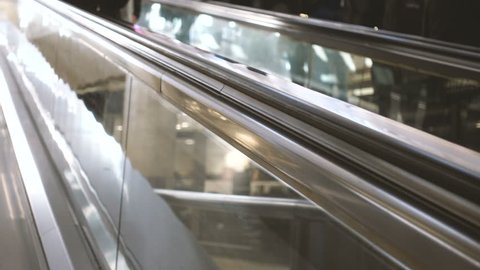 People on escalators in the city