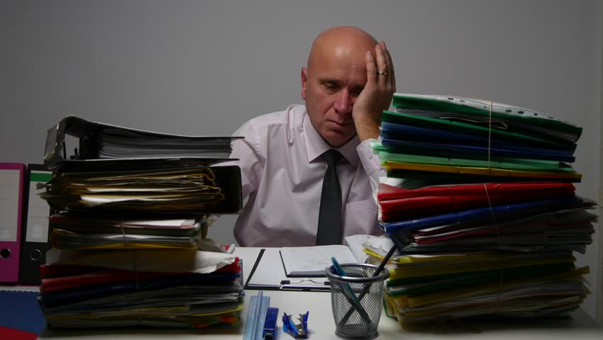 Businessman in Archive Room Surrounded by Files Looking Sad and Disappointed. (Ultra High Definition, UltraHD, Ultra HD, UHD, 4K, 3840x2160) Royalty-Free Stock Footage #23135926