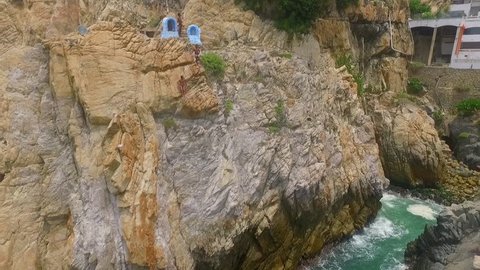 Aerial shot of people watching the divers prepairing their jump in La Quebrada Acapulco, Guerrero Mexico
