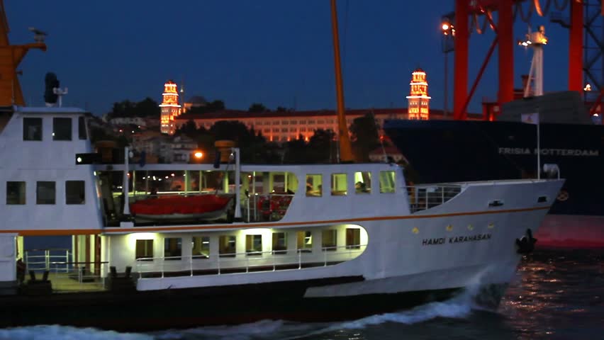 ISTANBUL - MAY 23: City passenger ship sails in front of docks on May 23, 2012