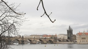 Scenery in Czechia capital with Vltava river and Charles bridge 4K 2160p 30fps UltraHD footage - Famous cityscape of Prague by the day 3840X2160 UHD video
