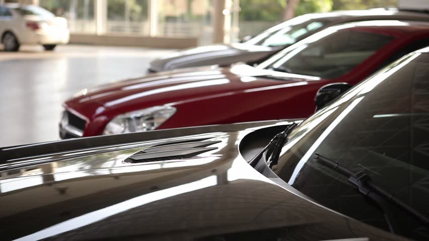 Camera slowly pans right over a car