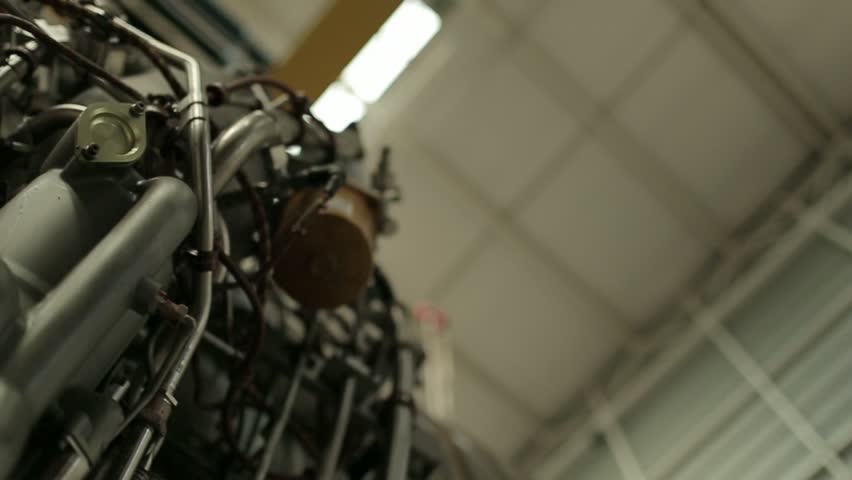 Circular tracking shot of exposed bulldozer engine. (Santiago, Chile - Jun 2016)