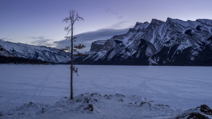 Early morning time lapse of scenic Minnewanka Lake in Banff National Park, Alberta Canada. 