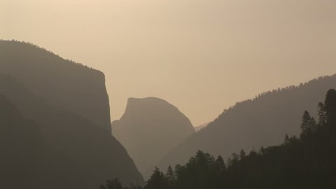 Half Dome and El Capitan at sunrise,Yosemite National Park, California, zoom in. Format: NTSC HDV Compression: MotionJPEG-A Camera: Sony HVR-Z1U Size: 1080i (1920 x 1080) Sound: No