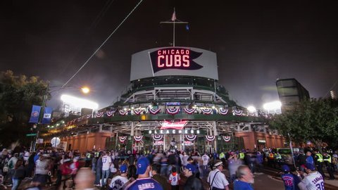 Chicago, Illinois - October 29th, 2016: Behind historic Wrigley Field during game 4 of the 2016 Major League Baseball World Series, corner of Waveland and Sheffield. Cubs vs. Indians 4K time lapse