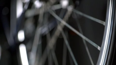 A bicycle wheel spinning in slow motion closeup