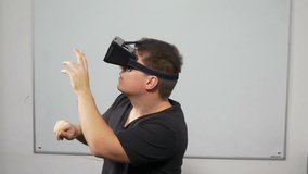 Man playing a game using virtual reality glasses