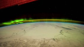 Aurora Borealis from Central U.S. on a pass from northeastern Canada to southern North Dakota. This video features the Aurora Borealis just north of a snow-covered Canada. 