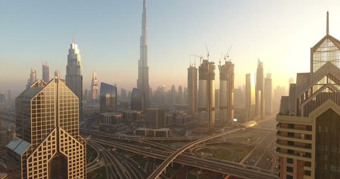 DUBAI, UAE - JANUARY 2, 2017: Aerial view of Burj Khalifa downtown Dubai at sunset. The Burj al Khalifa is the tallest structure in the world, standing at 829.8 m (2,722 ft). Scenic dusk 4K scene.