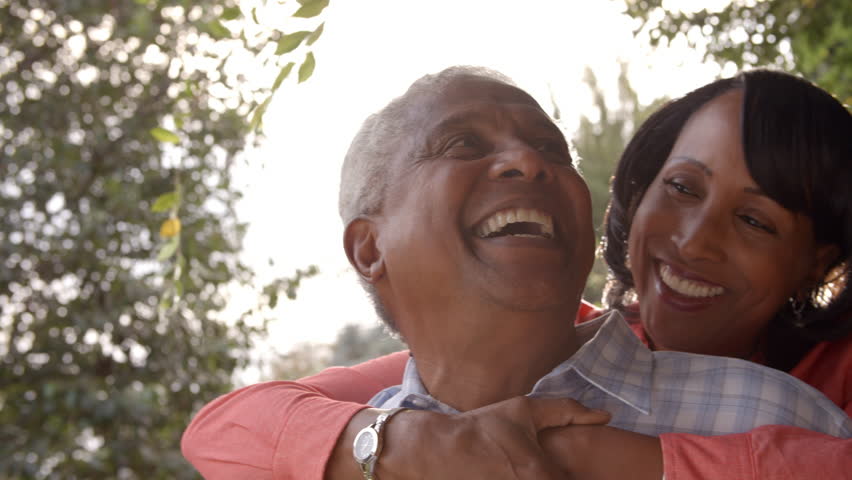 Senior black couple piggyback in garden, close up Royalty-Free Stock Footage #23190073