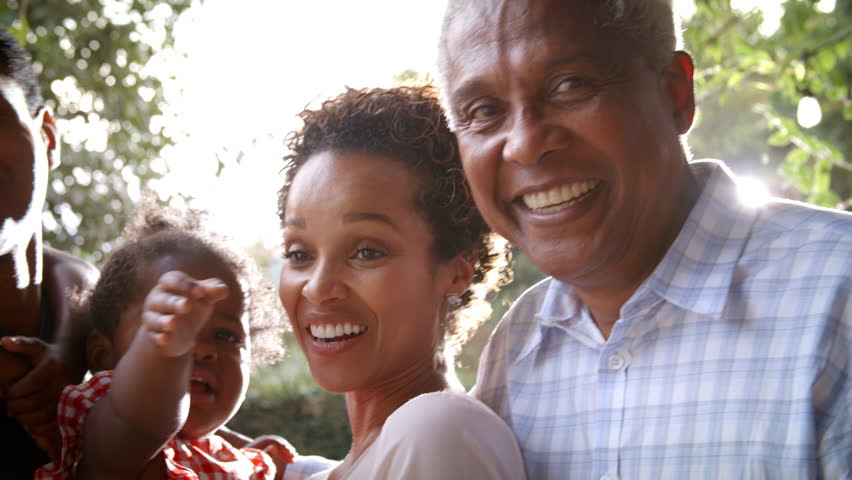 Multi generation black family in garden, handheld pan Royalty-Free Stock Footage #23190112