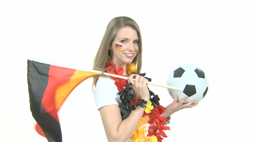 Attractive female Soccer Fan dances with German flag and kisses football