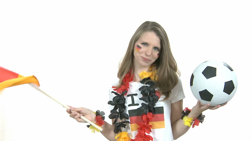 Attractive female Soccer Fan dances with German flag kisses football in