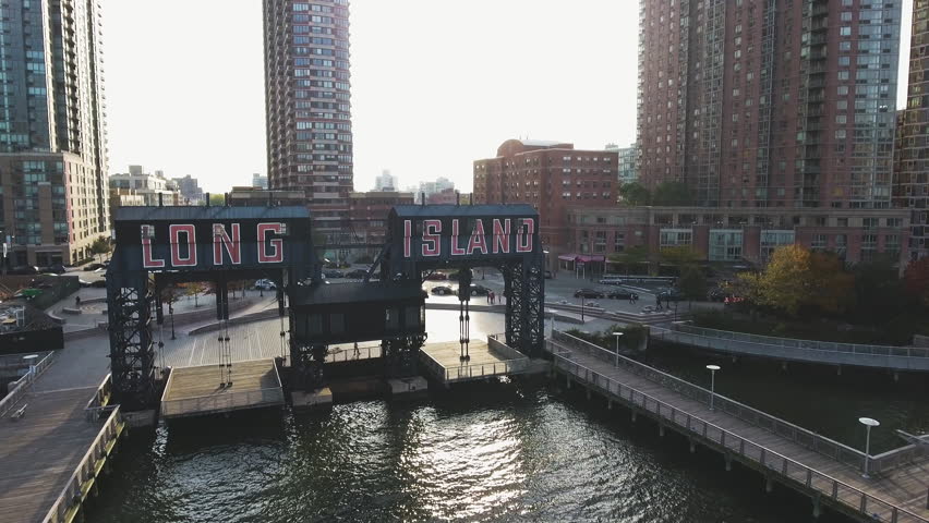 An establishing, aerial shot of Long Island City, a neighborhood in Queens, NY. Shot at sunrise during the autumn of 2016.