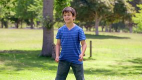 Smiling young boy playing rugby in the countryside - Powered by Shutterstock - Get 15% off with code: PIKWIZARD15
